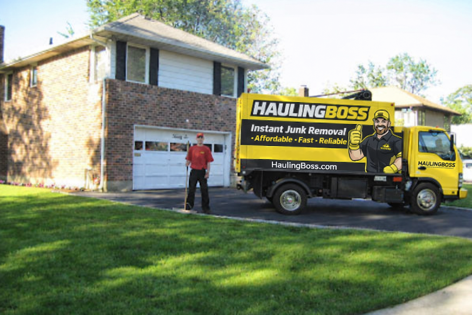 HaulingBoss junk removal truck with crew member in Baltimore
