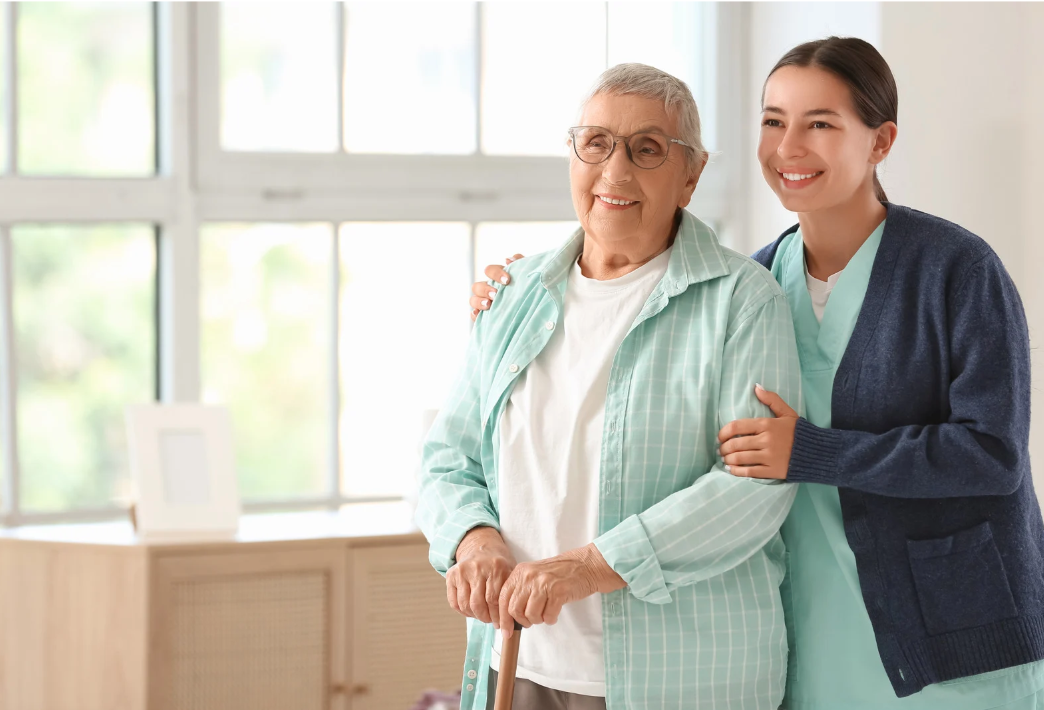 Community health worker assisting elderly patient