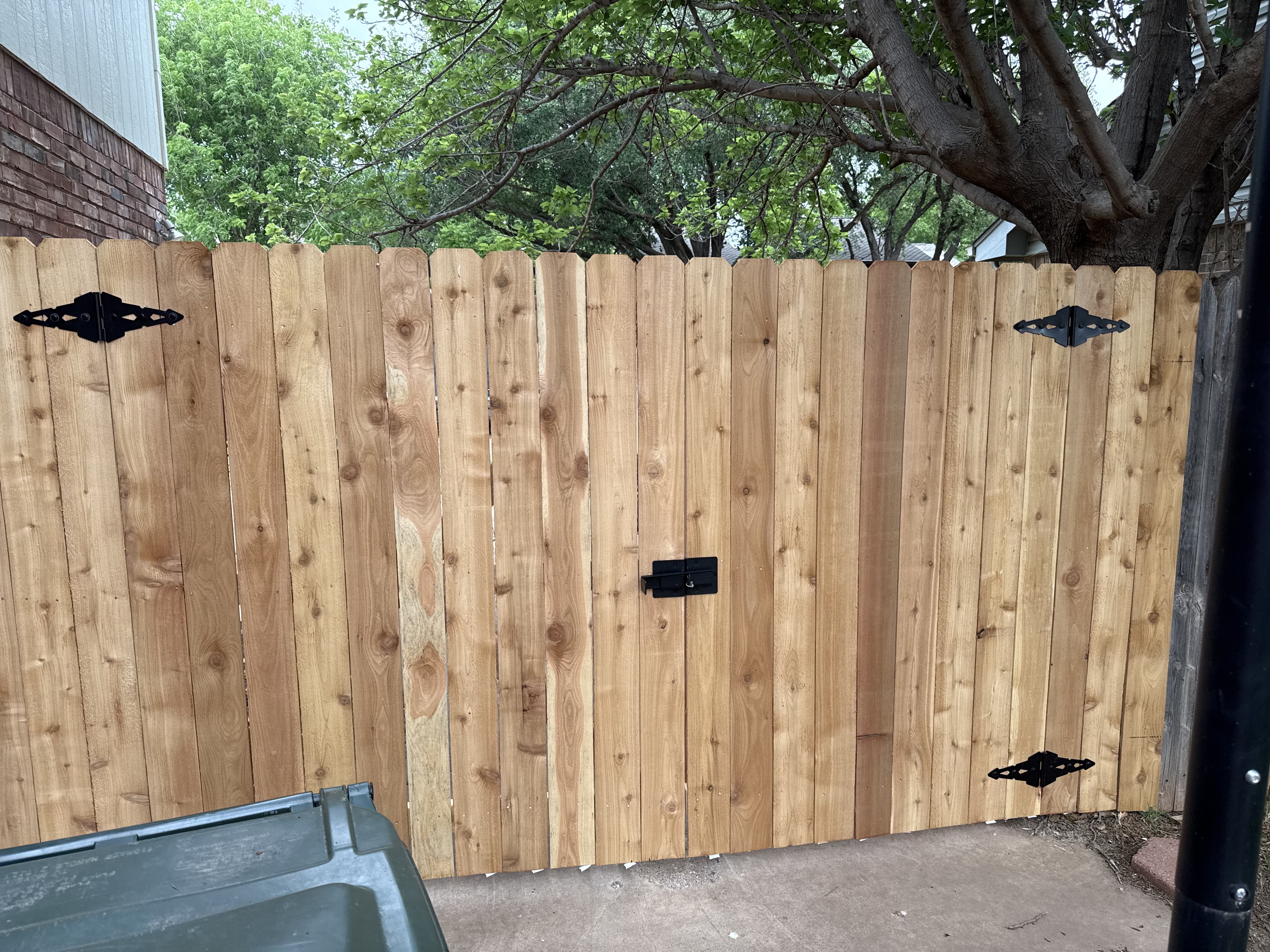 Cedar wood double gate with black hardware and latch