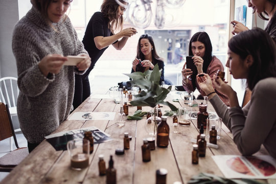 Fragrance workshop participants creating custom scents and perfumes