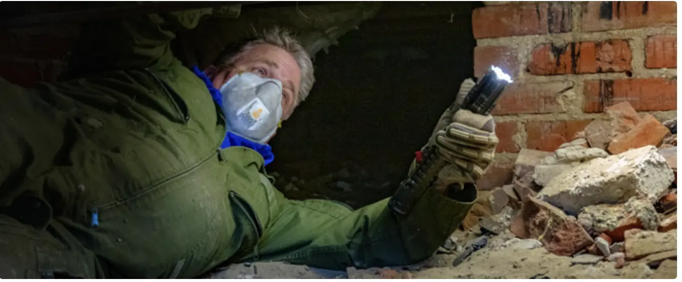 Eastline inspector examining crawlspace during WDIR inspection in New Bern NC
