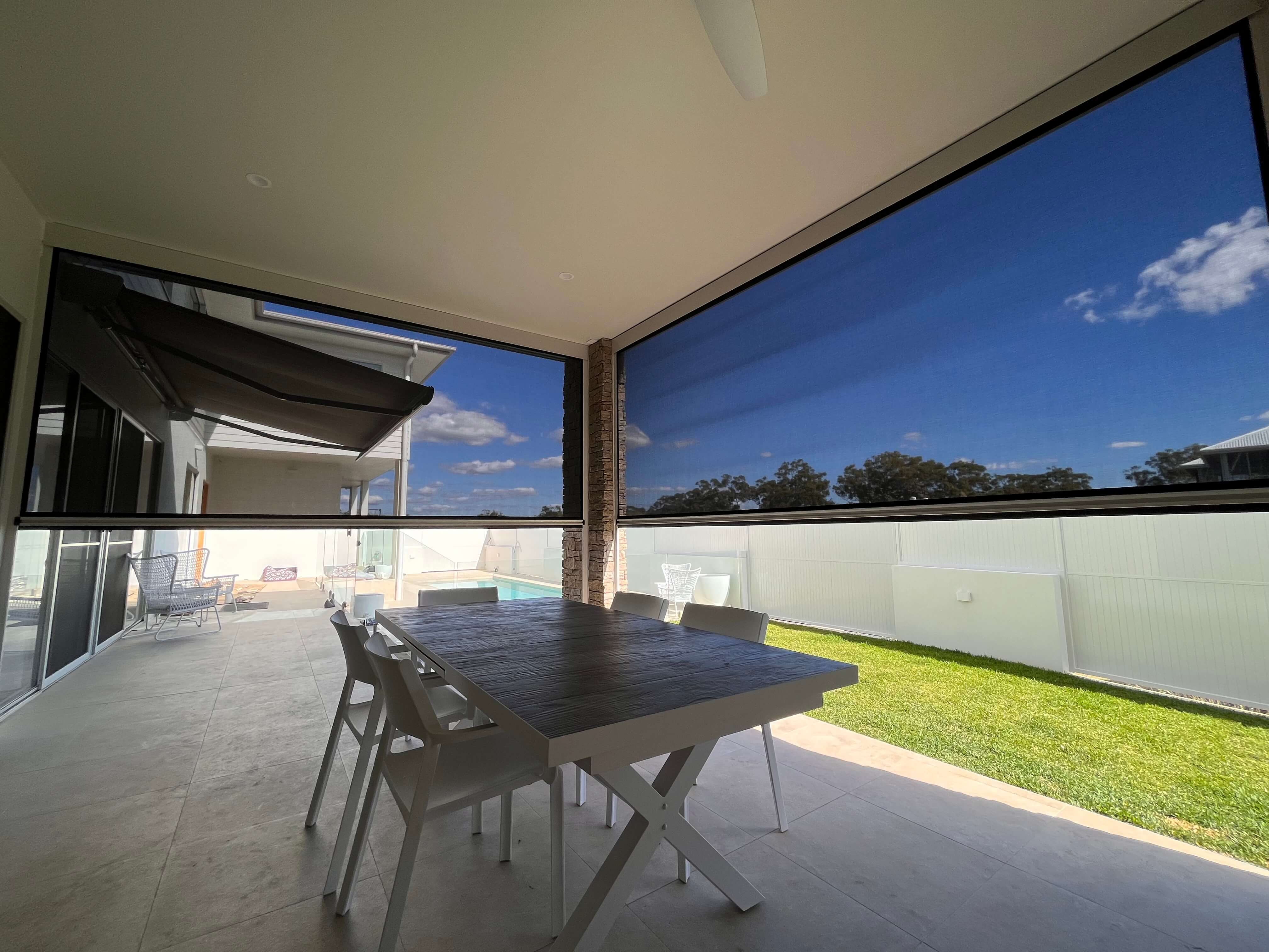 Ziptrak blinds enclosing an outdoor dining patio