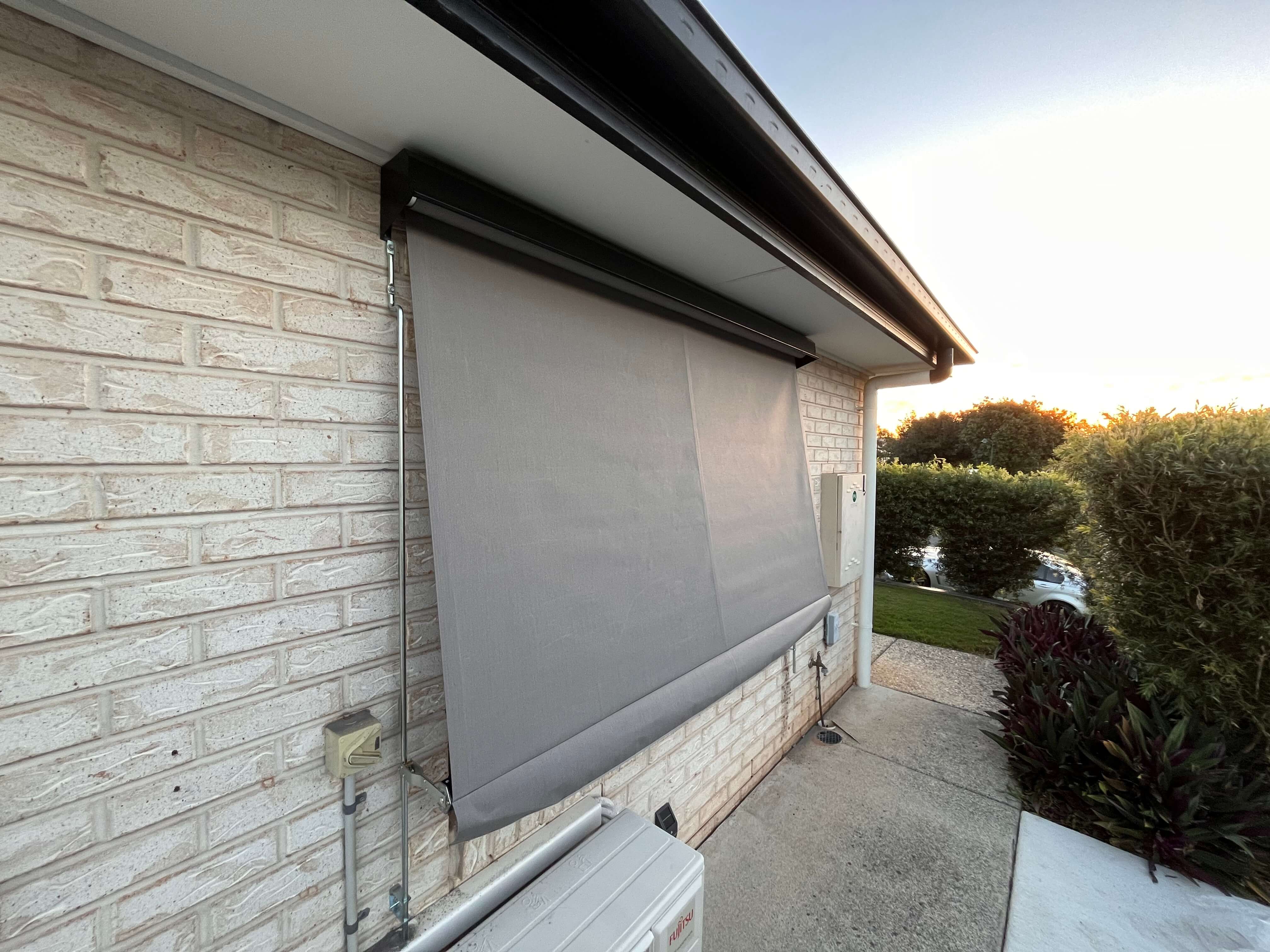 Traditional sun blind providing effective window shade on brick exterior