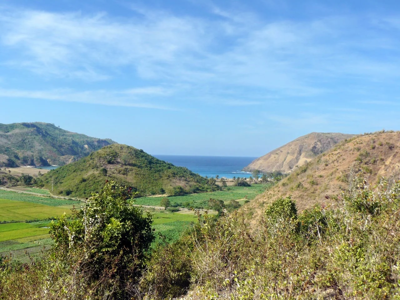 Full view of property with bay and mountains