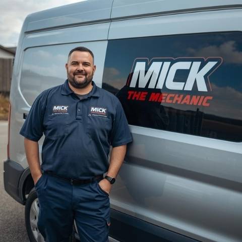 Mick The Mechanic standing next to his branded service van in Sydney